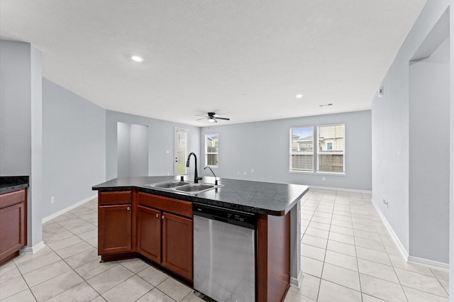 kitchen featuring a sink, dishwasher, open floor plan, and dark countertops