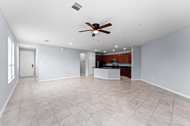 unfurnished living room with visible vents, recessed lighting, baseboards, and a ceiling fan
