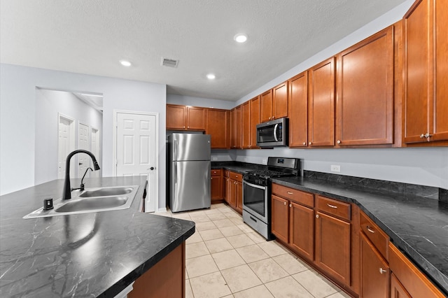 kitchen with visible vents, recessed lighting, a sink, appliances with stainless steel finishes, and light tile patterned floors