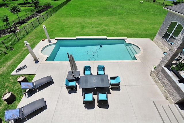view of swimming pool featuring a fenced in pool, a patio, a yard, and a fenced backyard