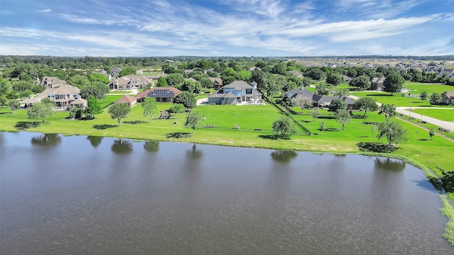 drone / aerial view featuring a water view and a residential view