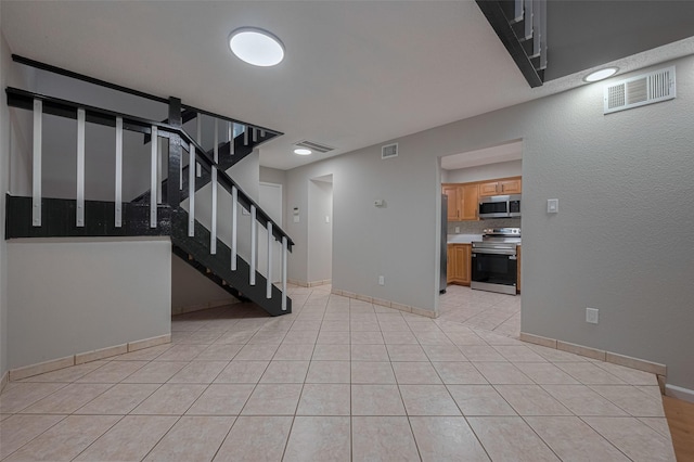 interior space with baseboards and visible vents