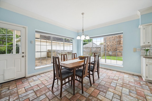 4107 Pebble Beach Dr, League City, TX 77573 - dining area featuring crown molding, baseboards, and a chandelier