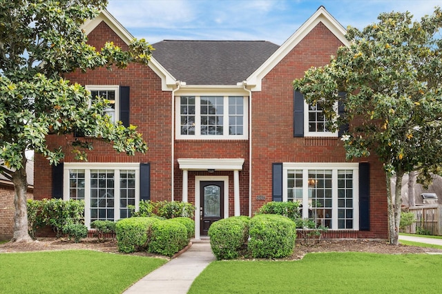 4107 Pebble Beach Dr, League City, TX 77573 - view of front of home with a front yard and brick siding