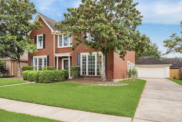 4107 Pebble Beach Dr, League City, TX 77573 - colonial house featuring brick siding, a front yard, and a garage