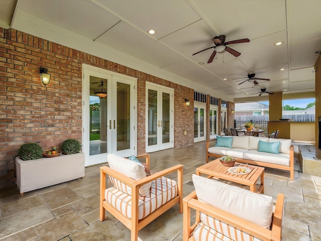 view of patio with french doors, fence, ceiling fan, and outdoor lounge area