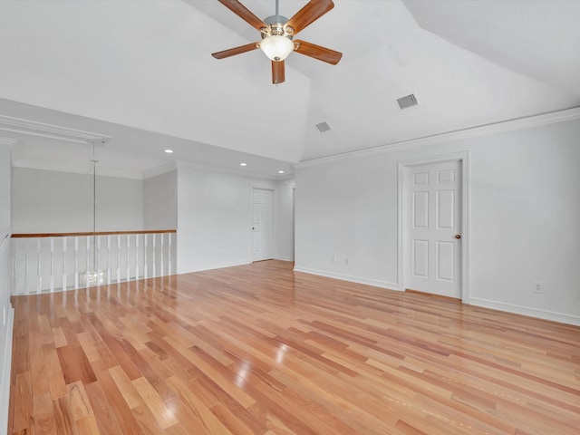 empty room featuring crown molding, ceiling fan, light wood-type flooring, and visible vents
