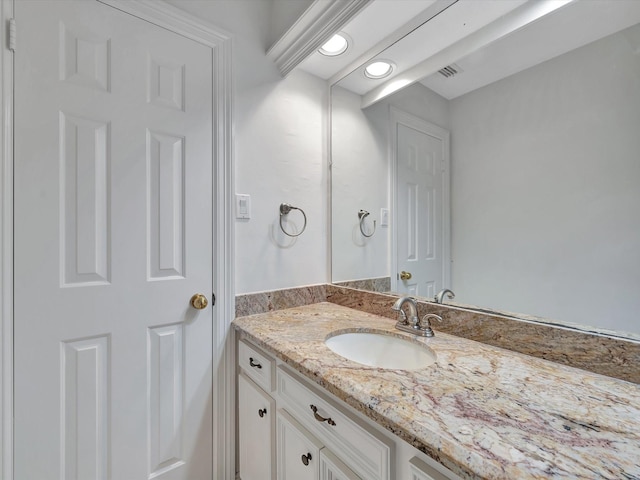 bathroom with vanity and visible vents