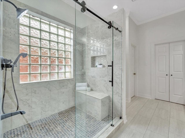 bathroom featuring tile patterned flooring and a shower stall