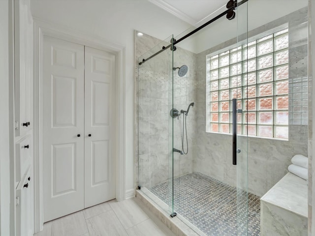 full bath featuring ornamental molding and a stall shower
