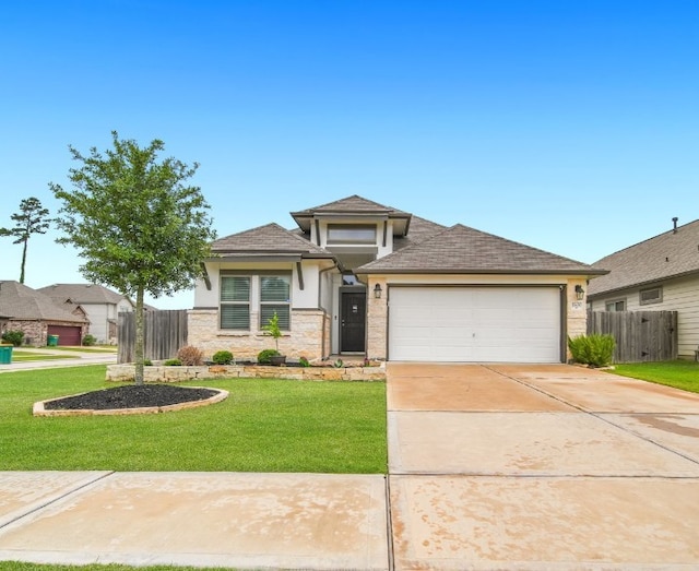 11430 Raven Claw Dr, Tomball, TX 77375 - prairie-style house featuring a garage, driveway, stucco siding, and roof with shingles