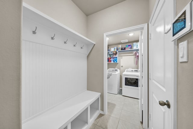 11430 Raven Claw Dr, Tomball, TX 77375 - mudroom with washer and dryer and light tile patterned floors