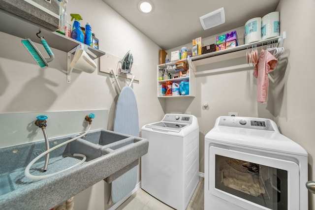 11430 Raven Claw Dr, Tomball, TX 77375 - clothes washing area with separate washer and dryer