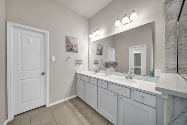 11430 Raven Claw Dr, Tomball, TX 77375 - bathroom with double vanity, tile patterned flooring, and baseboards