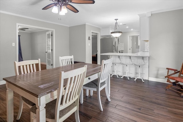 dining room featuring ceiling fan, dark wood-style floors, and baseboards