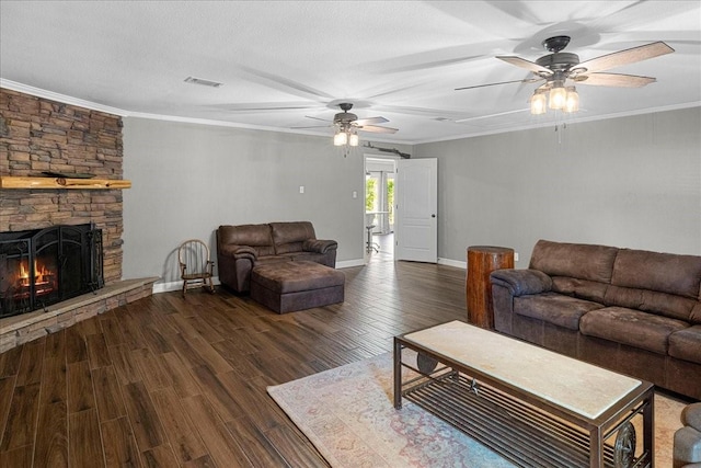 living room featuring ornamental molding, a ceiling fan, dark wood-style flooring, and visible vents