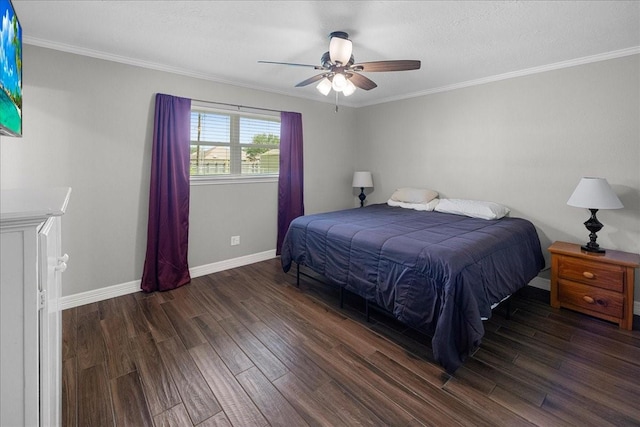 bedroom with baseboards, ornamental molding, and wood finished floors