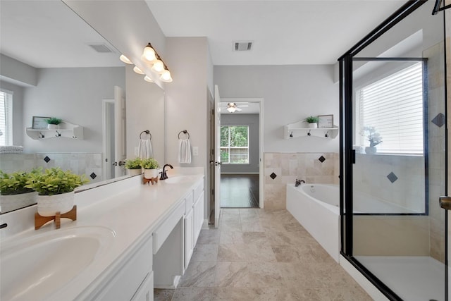 full bath featuring double vanity, visible vents, and a shower stall