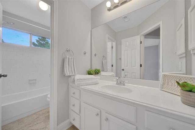 bathroom featuring vanity, toilet, baseboards,  shower combination, and visible vents