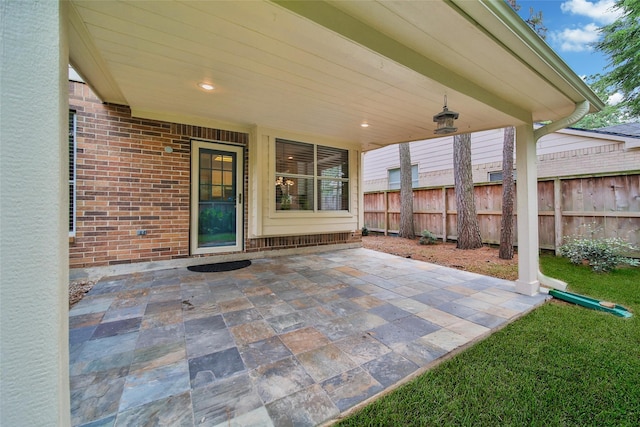 view of patio featuring fence