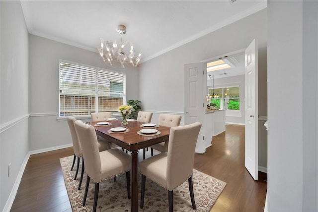 dining area with an inviting chandelier, ornamental molding, and dark wood-type flooring