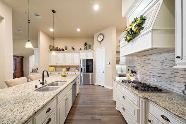 13105 Parc Cove Ct, Cypress, TX 77429 - kitchen featuring a sink, appliances with stainless steel finishes, custom range hood, backsplash, and recessed lighting