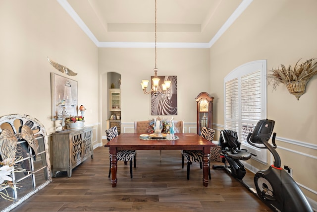 13105 Parc Cove Ct, Cypress, TX 77429 - dining space with a chandelier, a tray ceiling, a towering ceiling, dark wood-type flooring, and ornamental molding