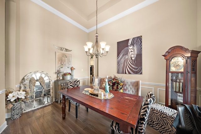 13105 Parc Cove Ct, Cypress, TX 77429 - dining room with a chandelier, crown molding, dark wood-style flooring, a high ceiling, and a wainscoted wall