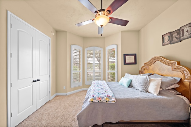 13105 Parc Cove Ct, Cypress, TX 77429 - bedroom with carpet flooring, baseboards, and ceiling fan