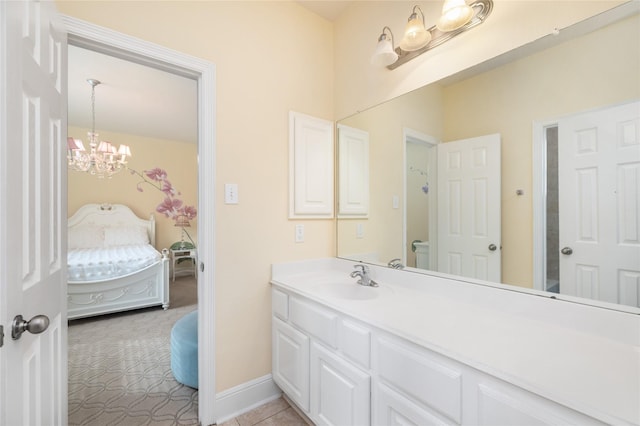 2010 Cias Trail Ln, Spring, TX 77386 - ensuite bathroom with ensuite bath, vanity, tile patterned floors, a chandelier, and baseboards
