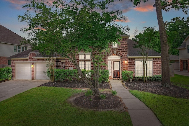 2010 Cias Trail Ln, Spring, TX 77386 - view of front of home with an attached garage, driveway, a front lawn, and brick siding