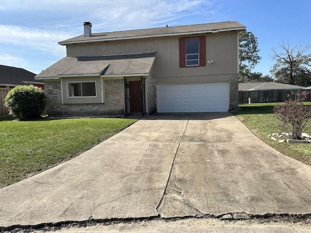 traditional-style house featuring fence, brick siding, a garage, a front yard, and concrete driveway