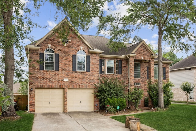 23026 Eastgate Village Dr, Spring, TX 77373 - view of front of home with roof with shingles, a garage, brick siding, a front lawn, and concrete driveway