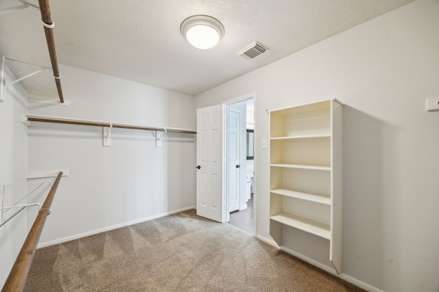 23026 Eastgate Village Dr, Spring, TX 77373 - spacious closet featuring carpet flooring and visible vents