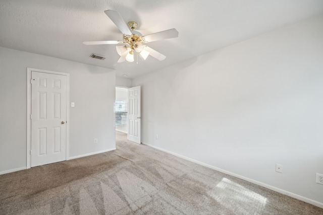 23026 Eastgate Village Dr, Spring, TX 77373 - carpeted spare room with ceiling fan, visible vents, and baseboards