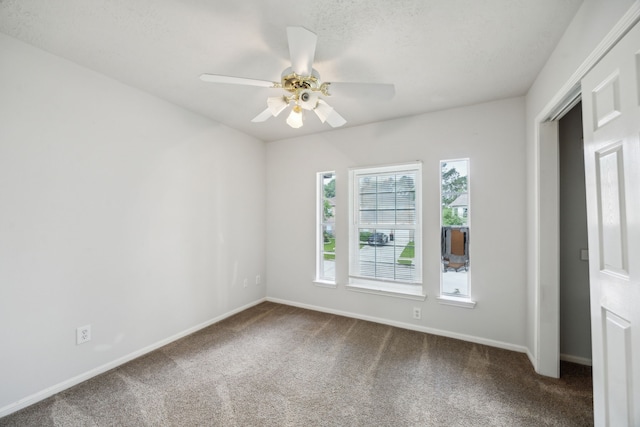23026 Eastgate Village Dr, Spring, TX 77373 - unfurnished room with carpet floors, baseboards, and ceiling fan