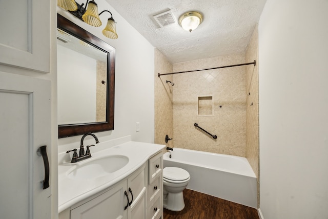 23026 Eastgate Village Dr, Spring, TX 77373 - bathroom with vanity, toilet, a textured ceiling, wood finished floors, and visible vents