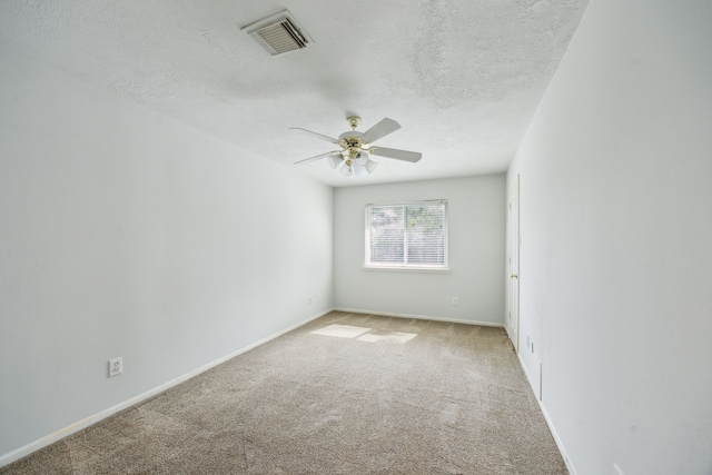 23026 Eastgate Village Dr, Spring, TX 77373 - spare room with visible vents, a ceiling fan, baseboards, a textured ceiling, and carpet flooring