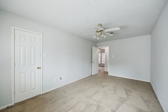 23026 Eastgate Village Dr, Spring, TX 77373 - unfurnished bedroom with baseboards, carpet flooring, and ceiling fan