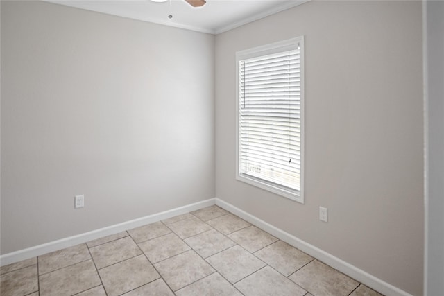 unfurnished room featuring crown molding, a ceiling fan, baseboards, and light tile patterned flooring