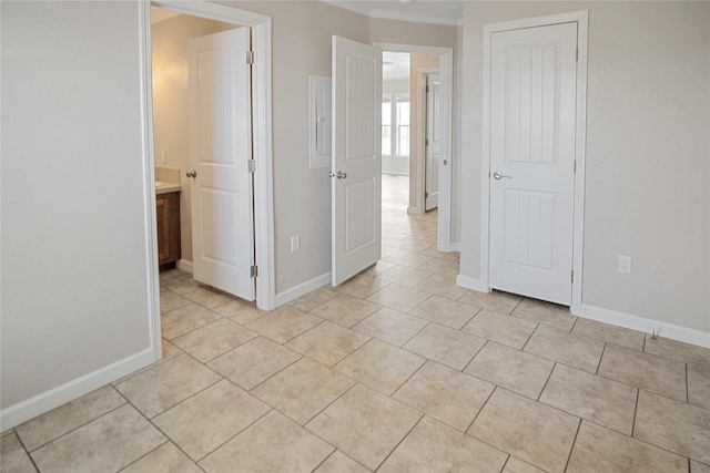 unfurnished bedroom featuring baseboards and light tile patterned floors