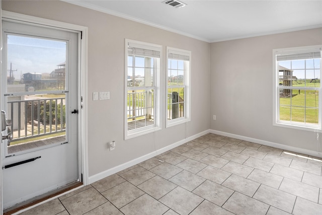 doorway to outside with crown molding, baseboards, plenty of natural light, and light tile patterned flooring