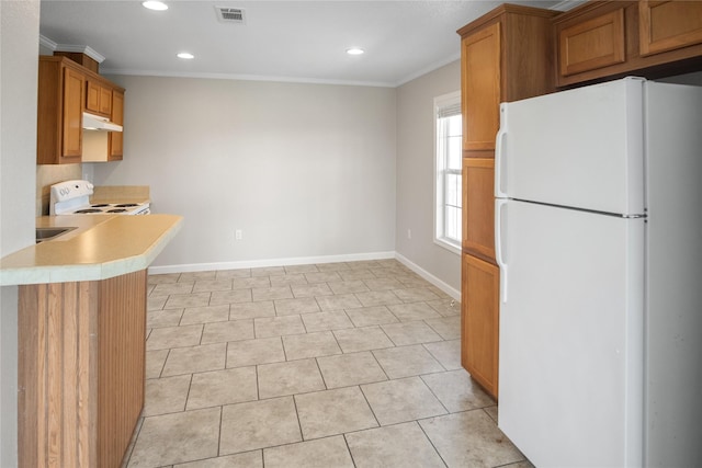 kitchen with visible vents, light countertops, under cabinet range hood, recessed lighting, and white appliances