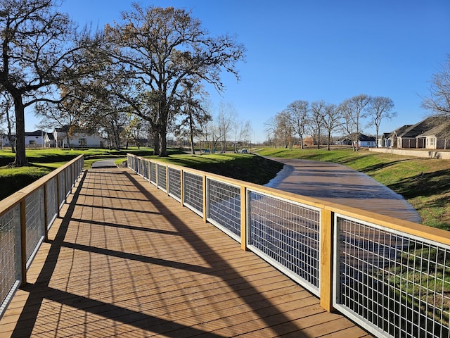 view of dock featuring a yard and a residential view