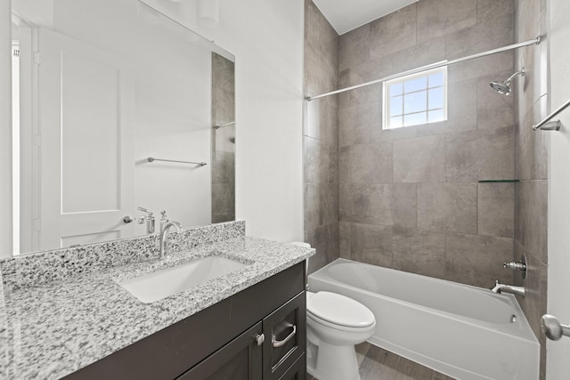 full bath with toilet, tub / shower combination, wood finished floors, and vanity