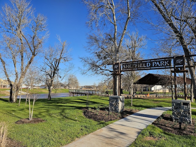 view of property's community featuring a yard