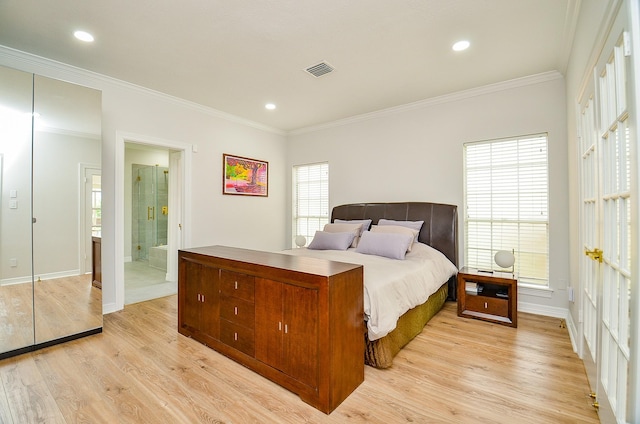 bedroom featuring visible vents, ornamental molding, light wood-style flooring, and baseboards