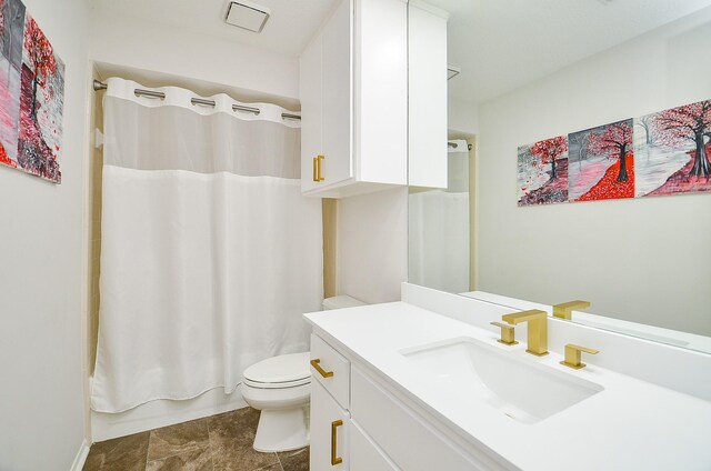 51 Asbury Park Ct, Sugar Land, TX 77479 - bathroom featuring vanity, shower / bathtub combination with curtain, visible vents, and toilet