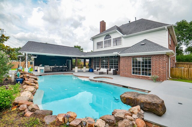 51 Asbury Park Ct, Sugar Land, TX 77479 - view of pool featuring fence, an in ground hot tub, an outdoor living space, and a patio area