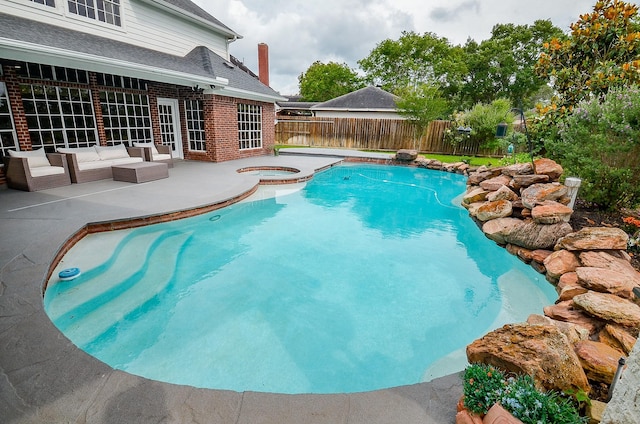 view of pool with a patio, a fenced backyard, an in ground hot tub, and a fenced in pool